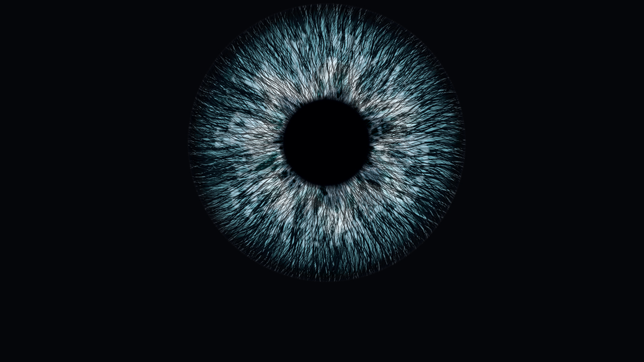 Light blue iris and black pupil on a black background, suggestive of an eye exam.