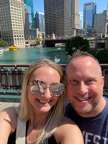 Mandy Wilk and her partner Chris Withers with Chicago skyline.