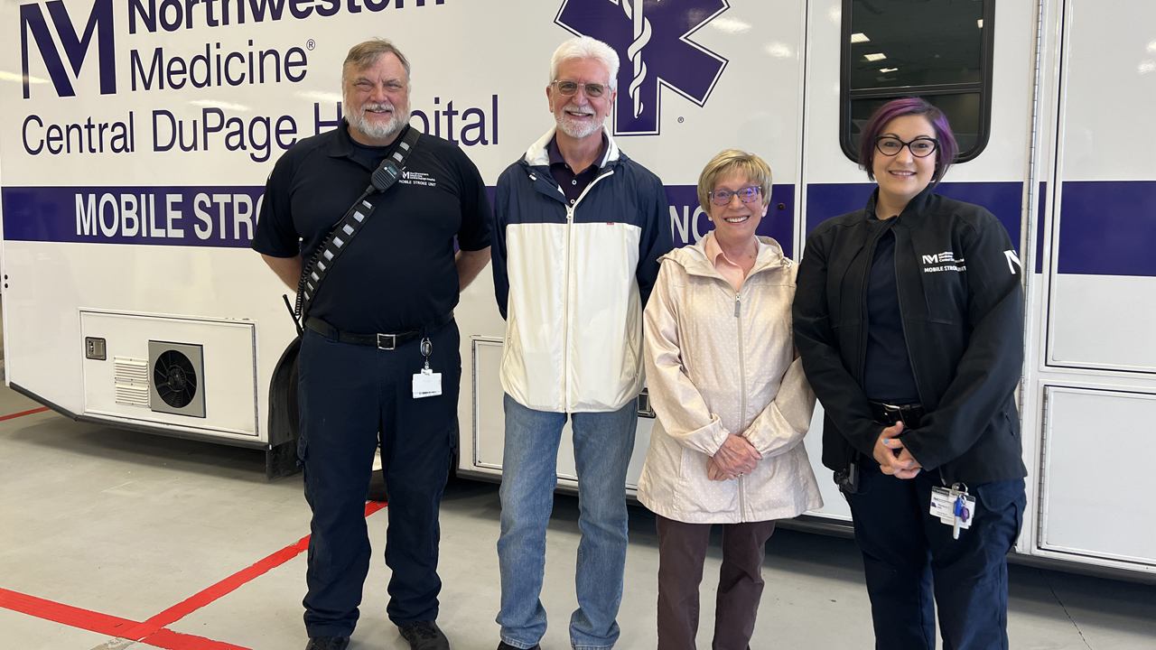 Northwestern Medicine patient, Karen Blinstrup, stands with her husband and two of the Mobile Stroke Unit team members who treated her.