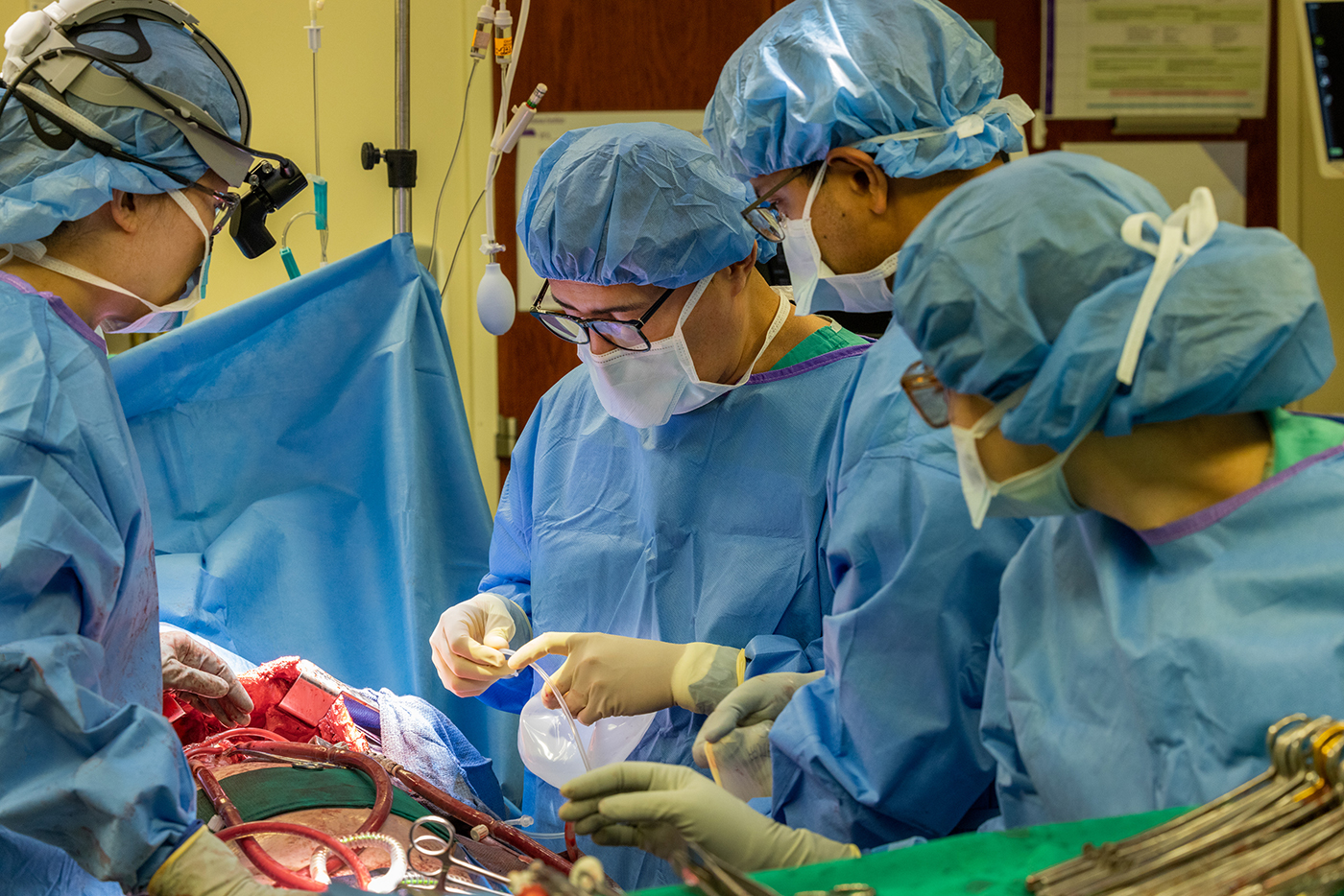 Davey’s surgical team inserting breast implants into his chest cavity. 