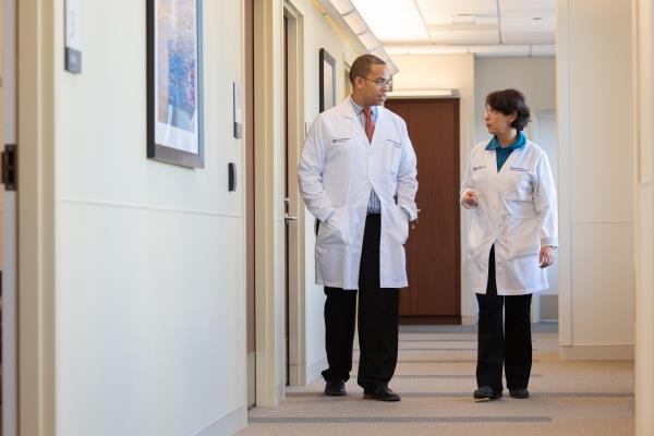 Peripheral Neuropathy physicians walking down a hallway