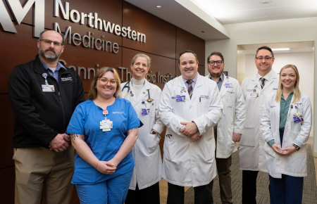 Medical staff members of the Northwestern Medicine Interstitial Lung Disease and Pulmonary Fibrosis Team standing next to each other and smiling.