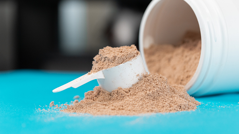 A scoop of brown powder. 