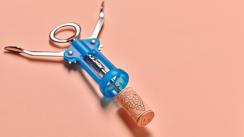 Blue corkscrew on a peach background.